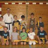 Abschluss des Kinder-Karatekurses mit Prüfung zum gelben Gürtel